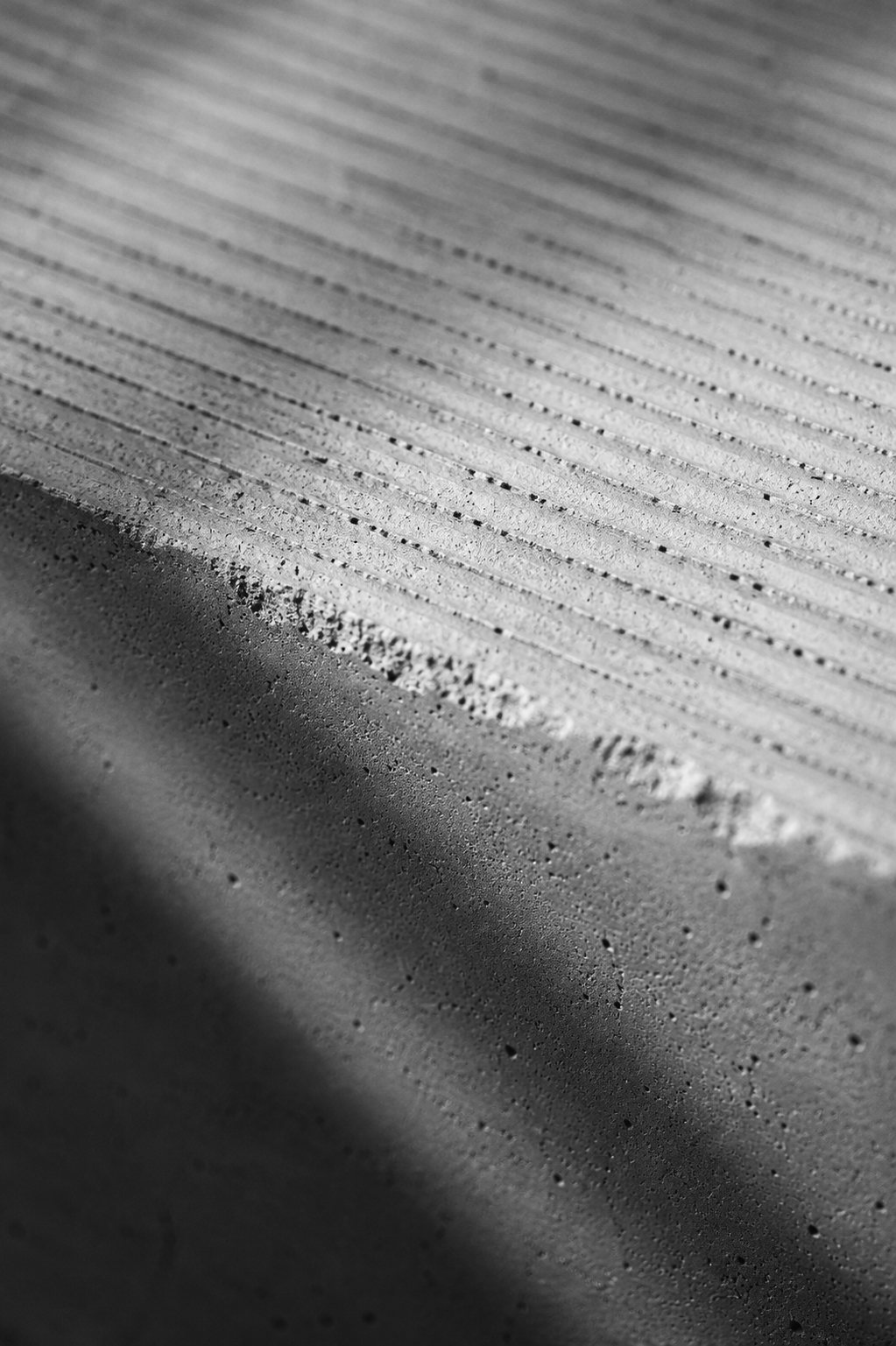 Concrete surface texture — material study, aggregate and finish visible