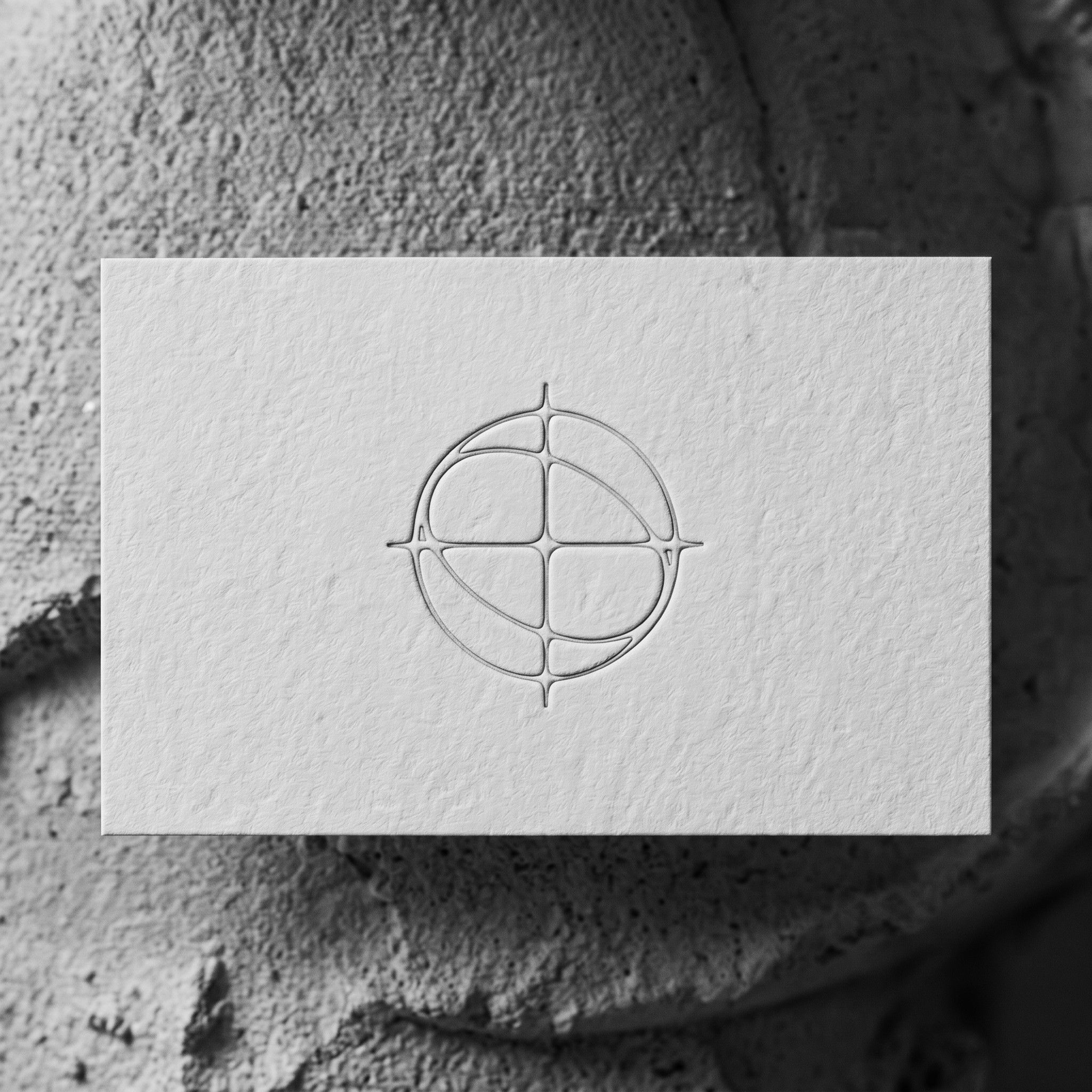 Proof card on concrete — embossed mark provenance artifact, ships with every edition